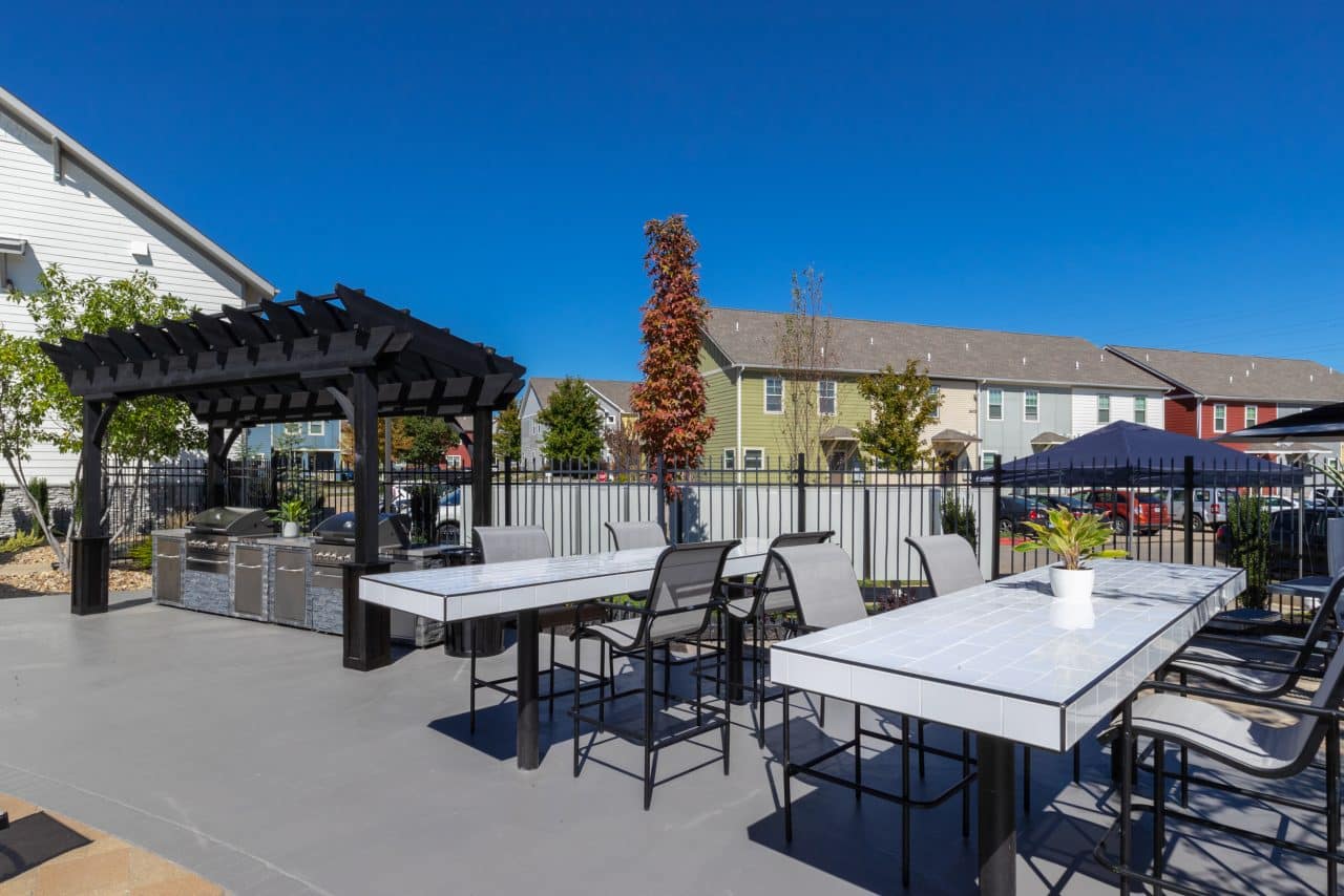 the-collective-at-columbia-apartments-near-the-university-of-missouri-grilling-station-tables
