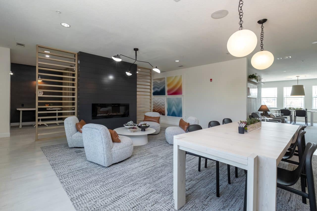 the collective at columbia apartments near the university of missouri resident clubhouse lounge seating fireplace